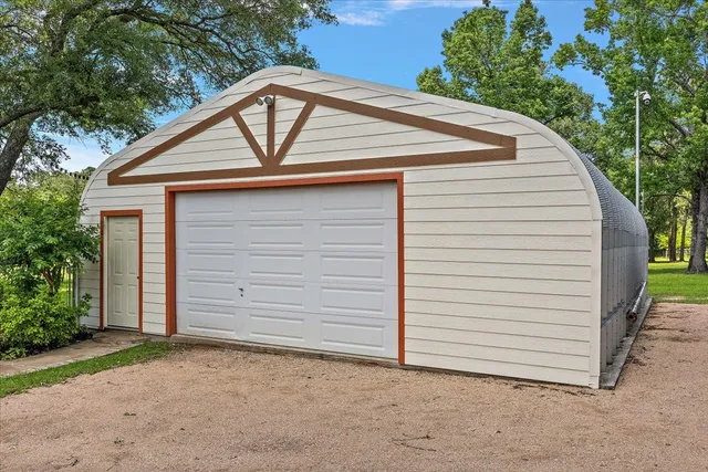 a small white house with a outdoor space