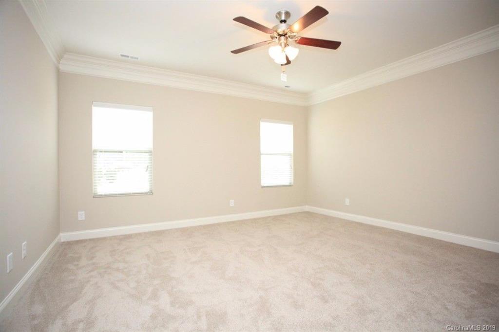 5326 Roberta Road Concord, NC 28027 - Photo 3 of 6 an empty room with a window and a fan