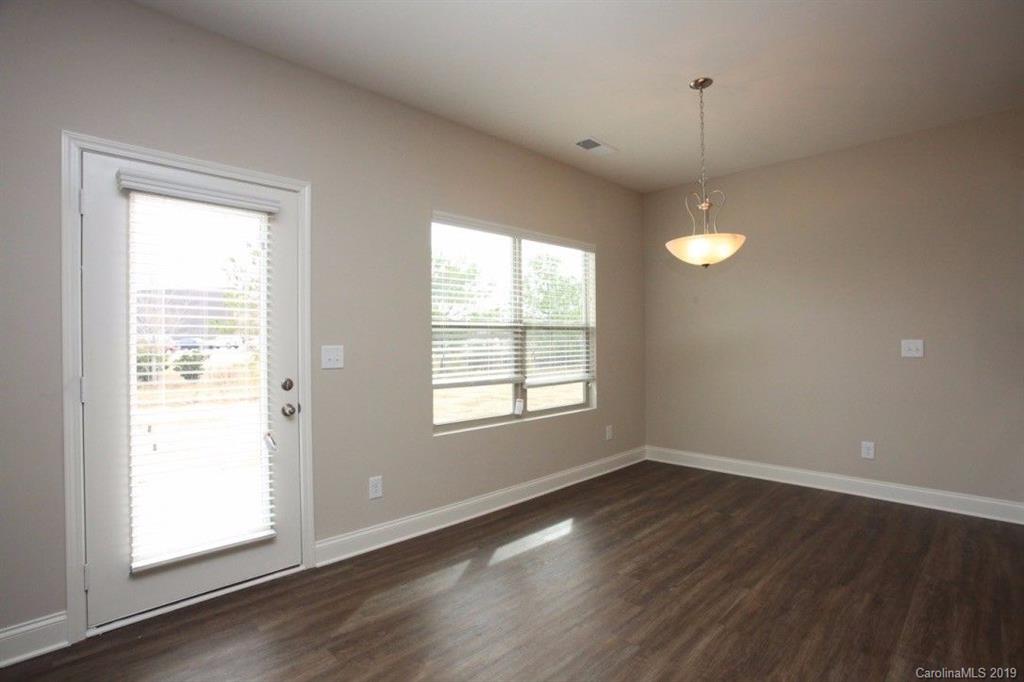 5326 Roberta Road Concord, NC 28027 - Photo 6 of 6 an empty room with wooden floor and windows