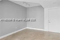 a kitchen with granite countertop a refrigerator and a stove