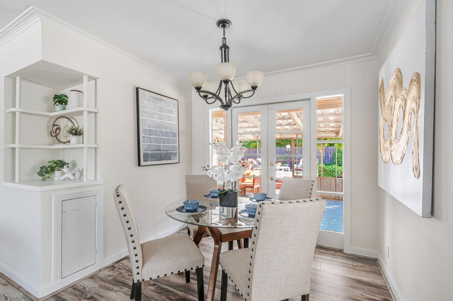 3993 Pasadena Drive San Mateo, CA 94403 - Photo 15 of 40 a view of a dining room with furniture wooden floor and a chandelier