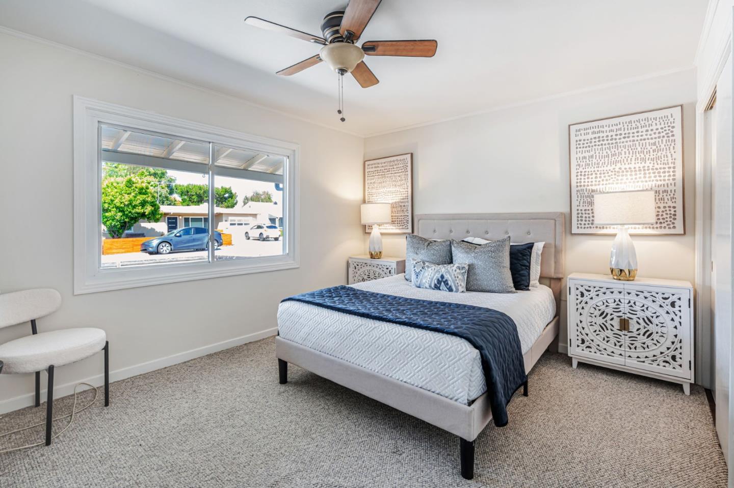 3993 Pasadena Drive San Mateo, CA 94403 - Photo 18 of 40 a spacious bedroom with a bed a window and potted plant