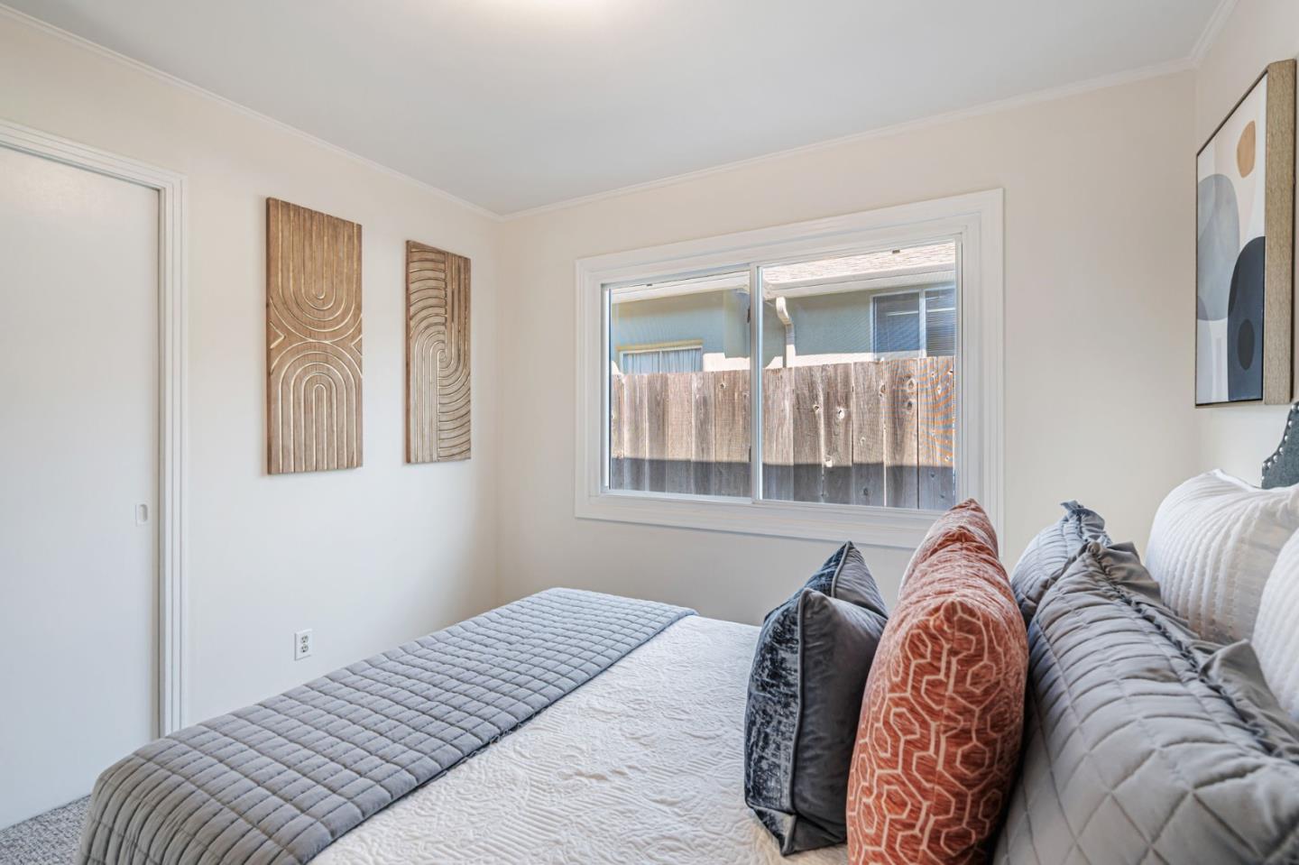 3993 Pasadena Drive San Mateo, CA 94403 - Photo 24 of 40 a bedroom with a bed and a window