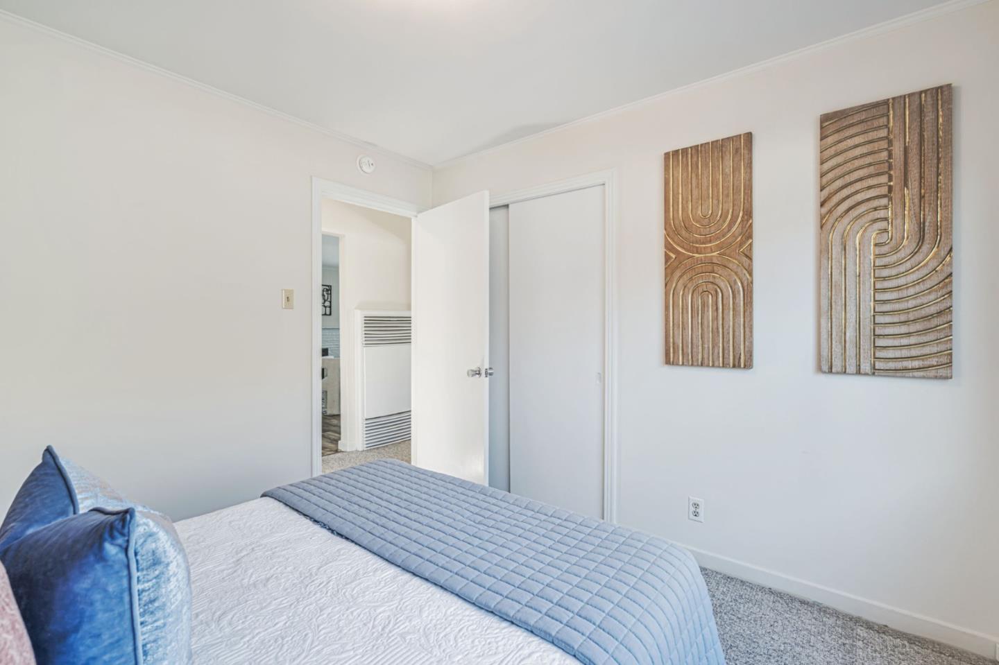 3993 Pasadena Drive San Mateo, CA 94403 - Photo 25 of 40 a bedroom with a bed and a window