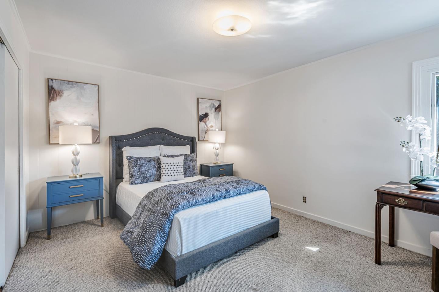 3993 Pasadena Drive San Mateo, CA 94403 - Photo 26 of 40 a bedroom with a bed and a table in it