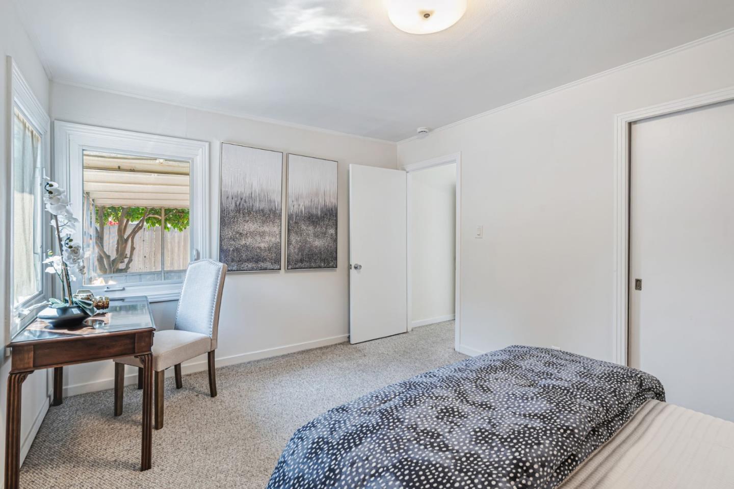 3993 Pasadena Drive San Mateo, CA 94403 - Photo 29 of 40 a living room with a couch and a table