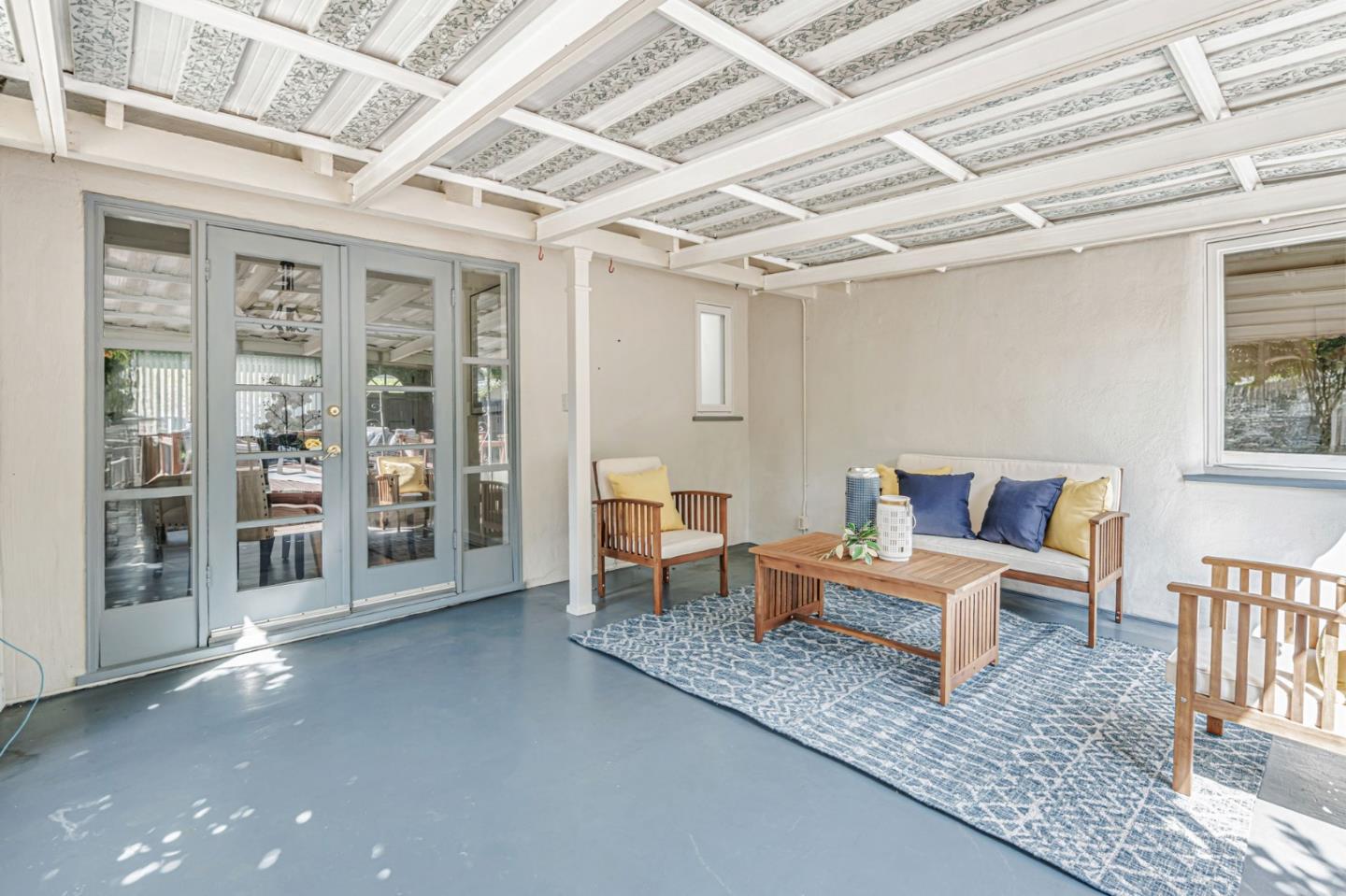 3993 Pasadena Drive San Mateo, CA 94403 - Photo 36 of 40 a living room with furniture and a chandelier