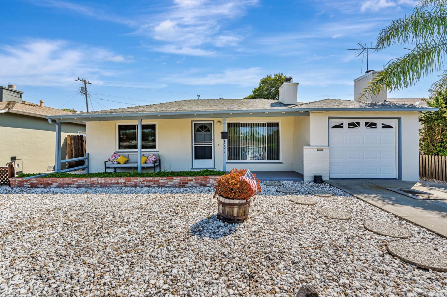 3993 Pasadena Drive San Mateo, CA 94403 - Photo 4 of 40 a front view of a house with garden