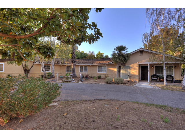 12943 Pierce Road Saratoga, CA 95070 - Photo 2 of 6 a front view of a house with a garden