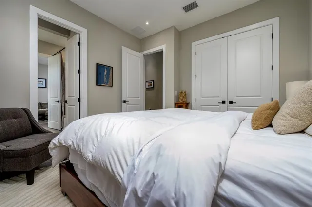 a bathroom with a double vanity sink mirror and shower
