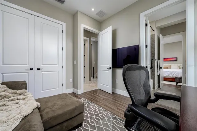 a kitchen with a sink a counter space appliances and cabinets