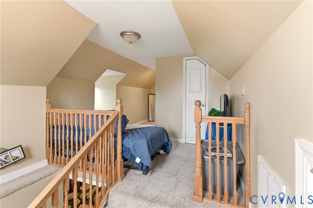 1311 Williamsburg Road Richmond, VA 23231 - Photo 25 of 38 Carpeted loft area featuring warm-toned walls, slo