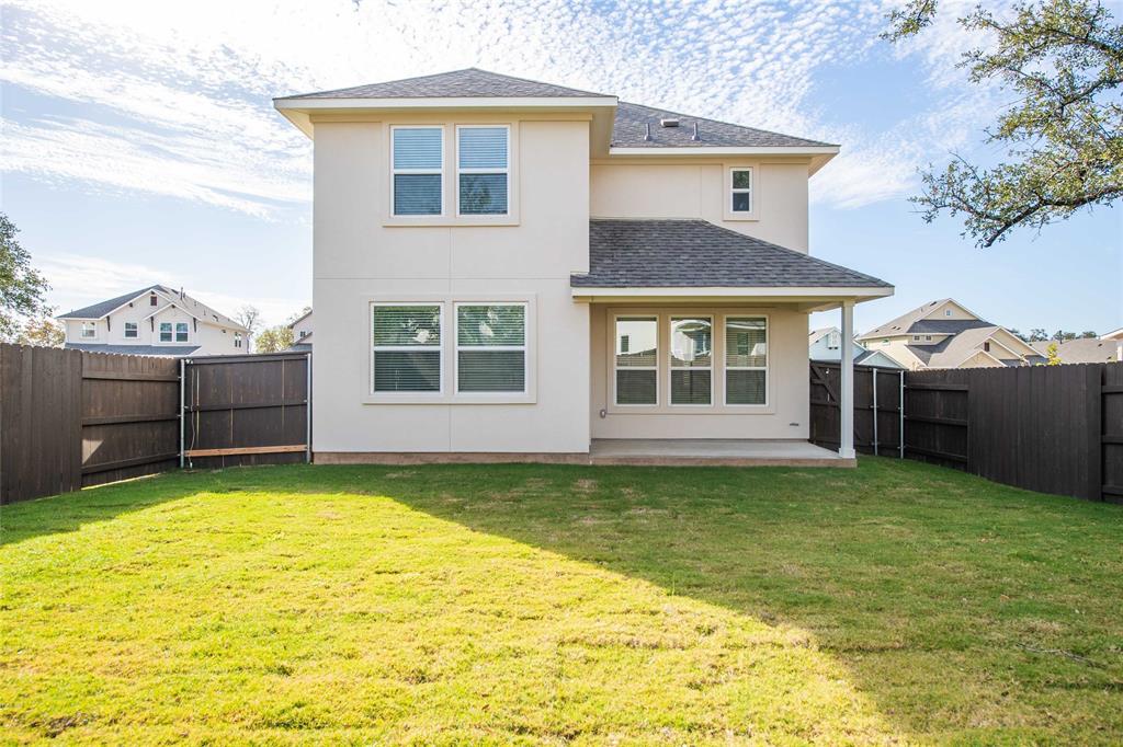 2605 Sam Bass Road, Unit 91 Round Rock, TX 78681 - Photo 32 of 32 a view of a house with a swimming pool and a yard