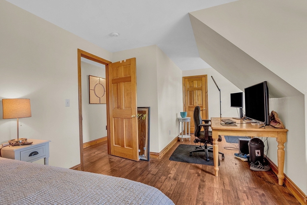 8 Ryan Road Townsend, MA 01474 - Photo 36 of 39 a bedroom with furniture and a flat screen tv