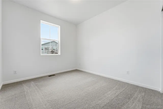 an empty room with a bench