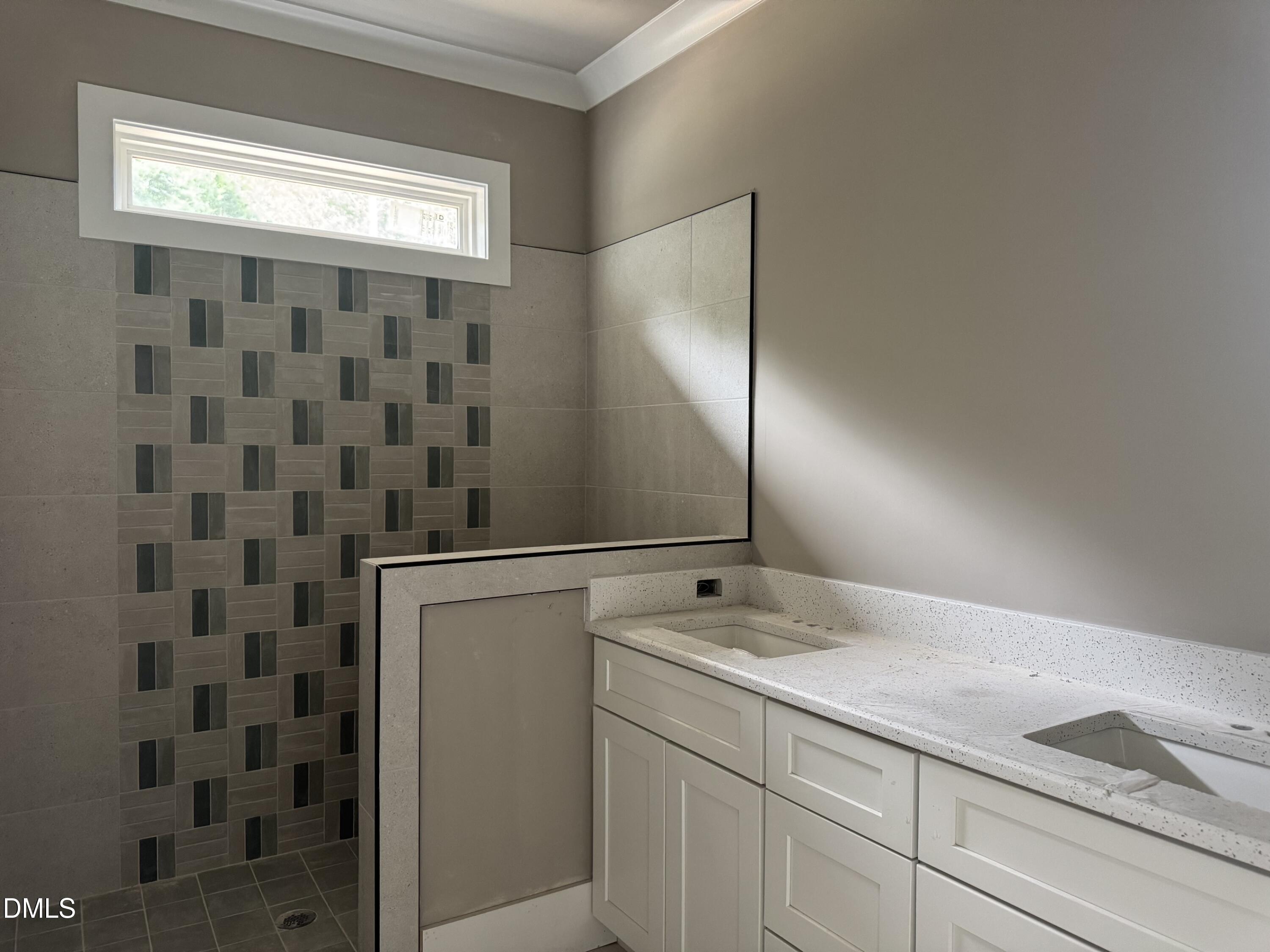 935 Lynch Road Selma, NC 27576 - Photo 12 of 21 a bathroom with a granite countertop sink a toilet and a shower