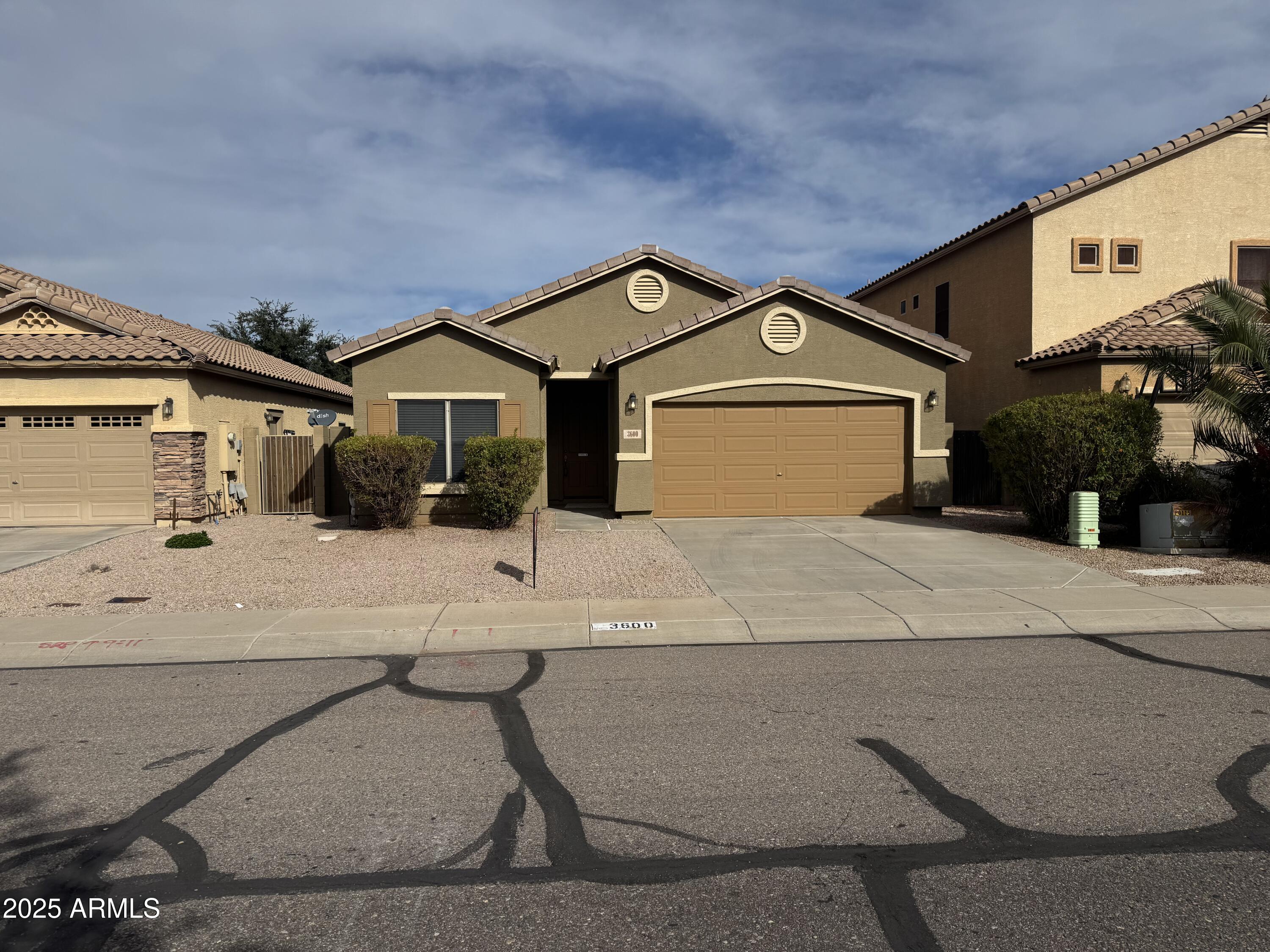 3600 East Denim Trail San Tan Valley, AZ 85143 - Photo 2 of 50 a front view of a house with a yard