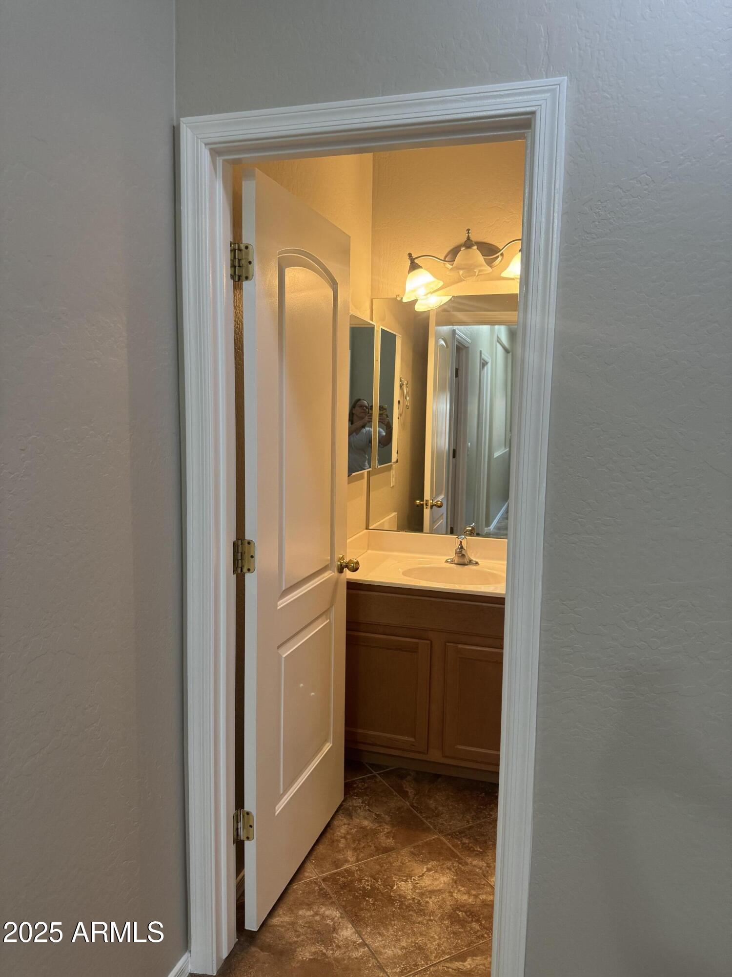 3600 East Denim Trail San Tan Valley, AZ 85143 - Photo 24 of 50 a bathroom with a granite countertop sink mirror and a bathtub