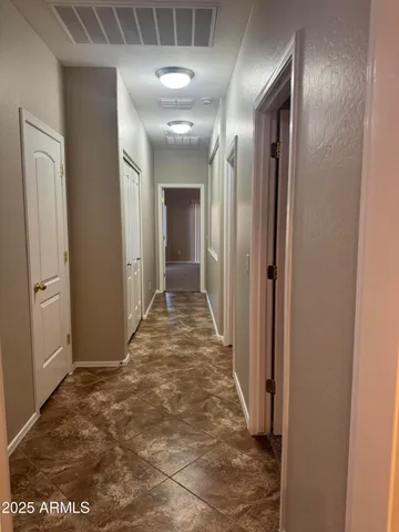 a view of a livingroom with a ceiling fan and window