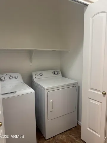 a view of a bathroom with a sink and mirror