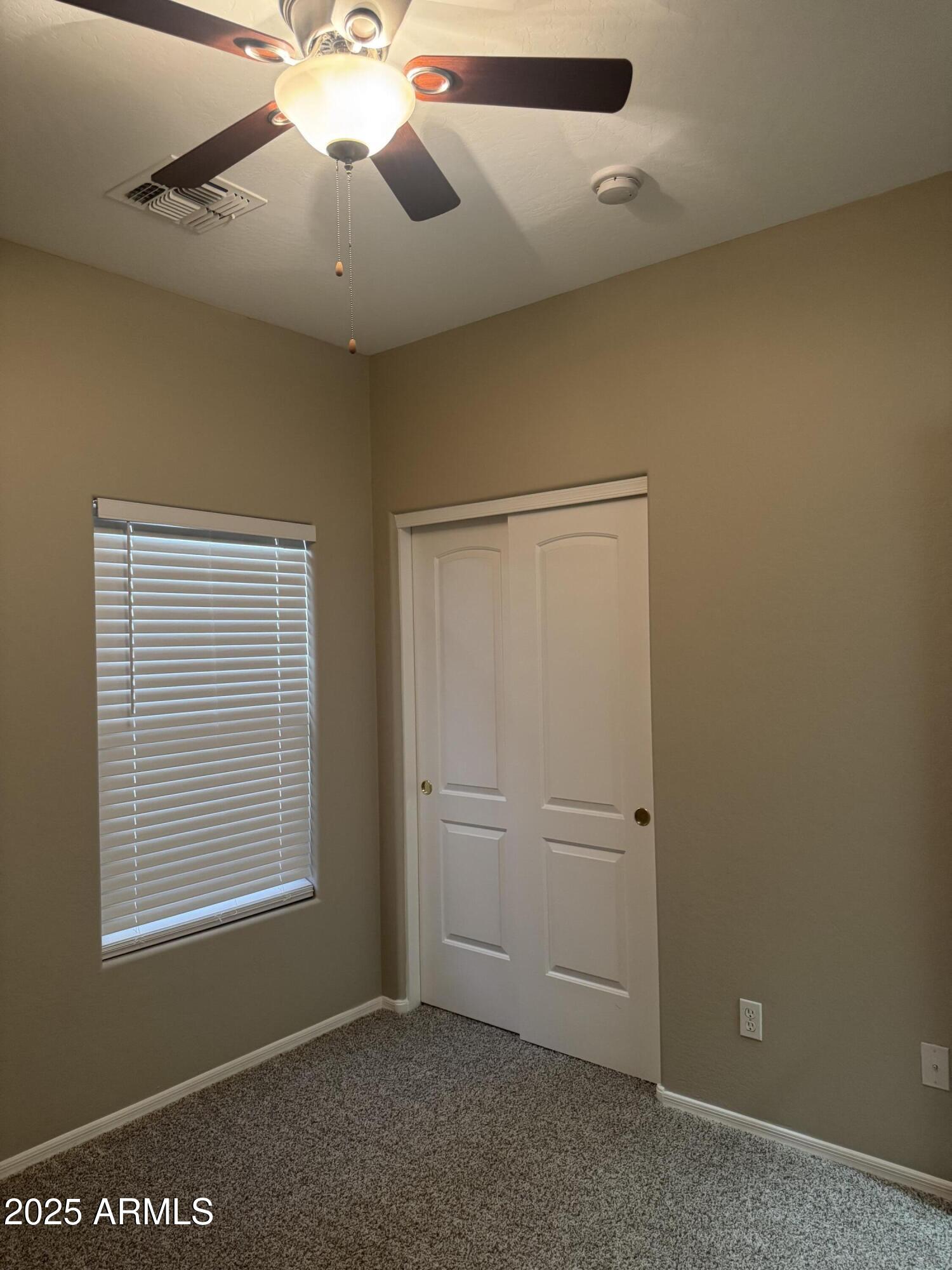 3600 East Denim Trail San Tan Valley, AZ 85143 - Photo 33 of 50 an empty room with windows and fan