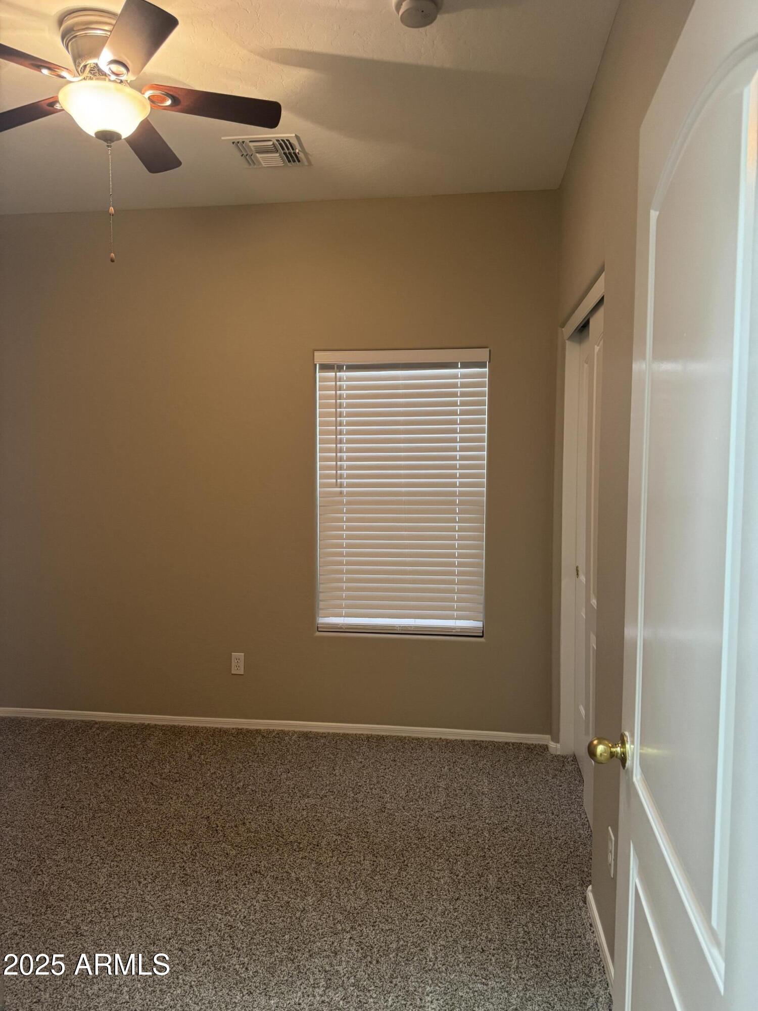 3600 East Denim Trail San Tan Valley, AZ 85143 - Photo 34 of 50 an empty room with windows and fan