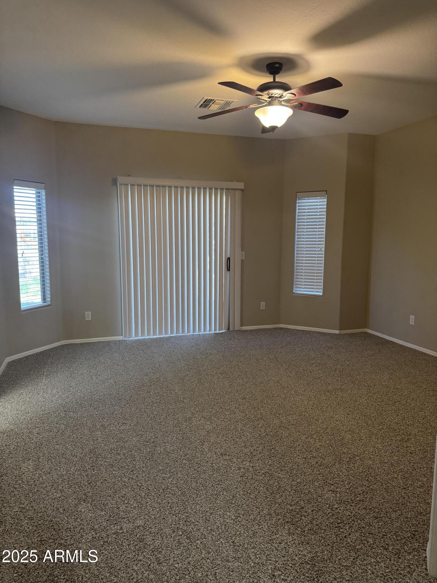3600 East Denim Trail San Tan Valley, AZ 85143 - Photo 35 of 50 a view of a livingroom with a ceiling fan and window