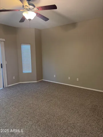 a view of a backyard with large trees