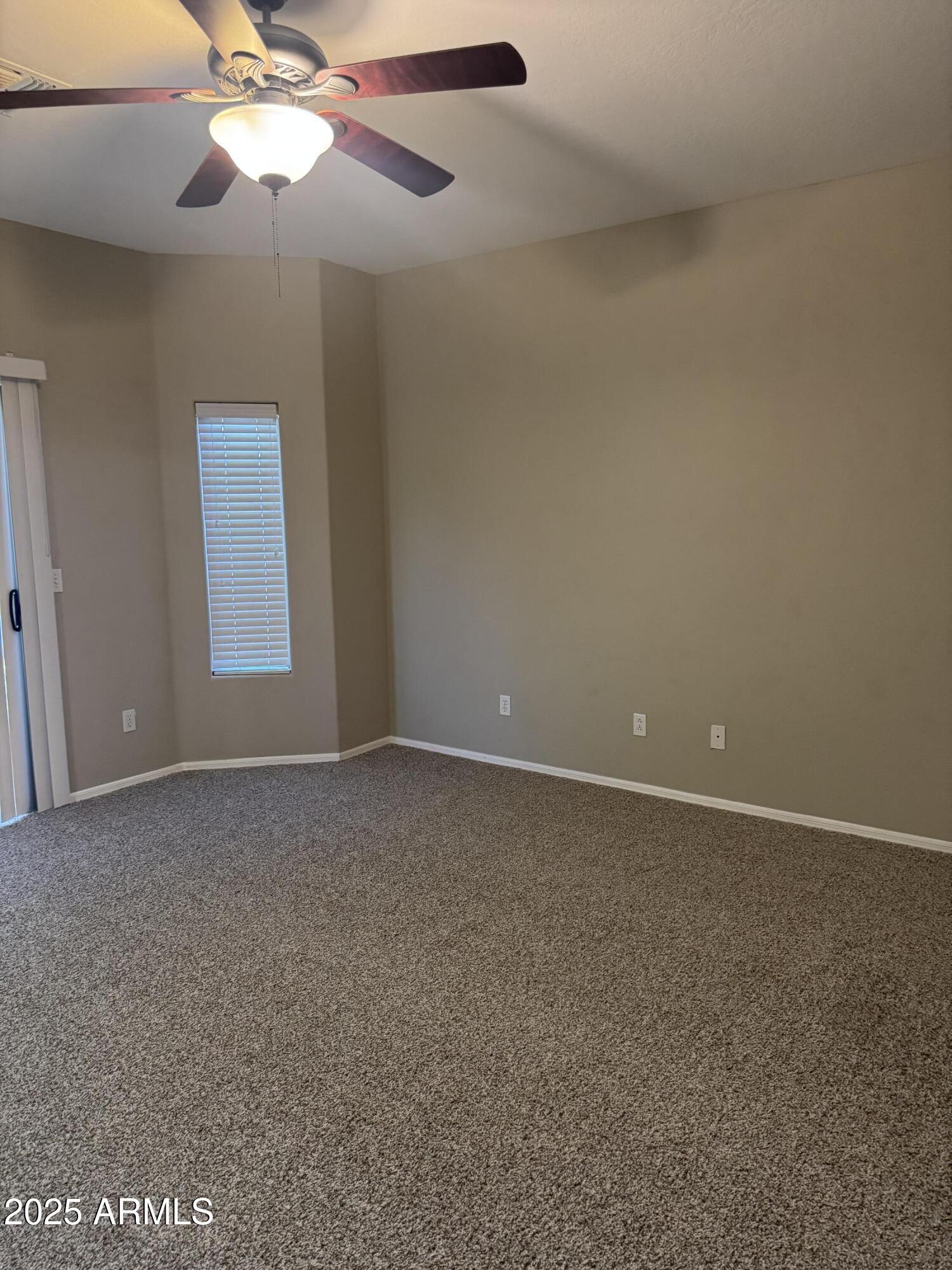3600 East Denim Trail San Tan Valley, AZ 85143 - Photo 38 of 50 an empty room with a window and a fan