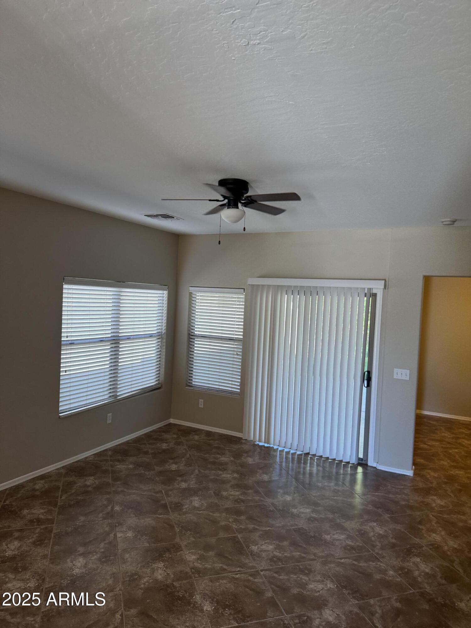 3600 East Denim Trail San Tan Valley, AZ 85143 - Photo 45 of 50 an empty room with wooden floor and windows