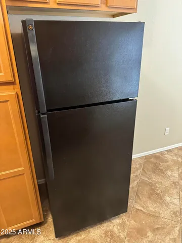a stove top oven sitting inside of a kitchen