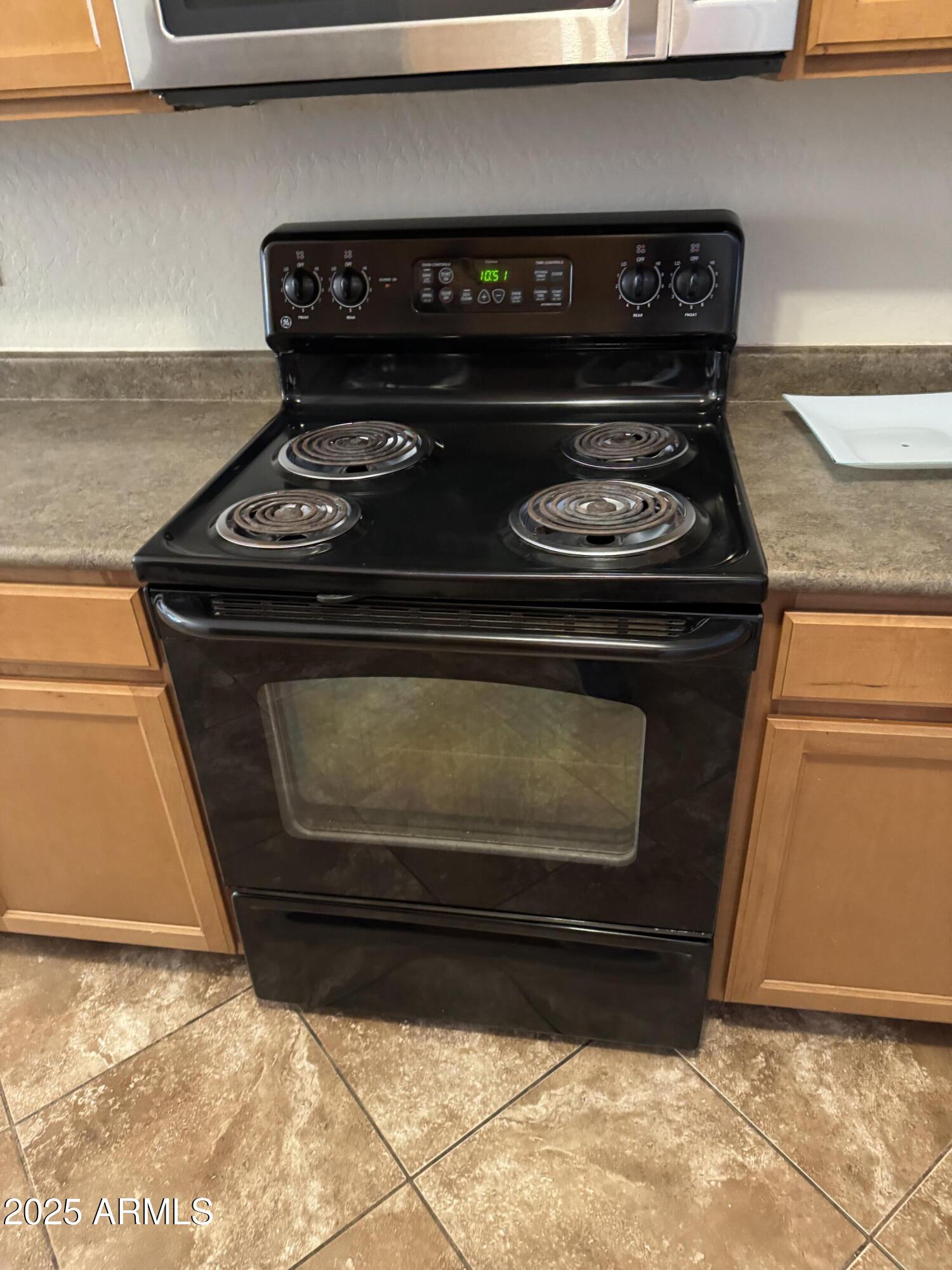 3600 East Denim Trail San Tan Valley, AZ 85143 - Photo 9 of 50 a stove top oven sitting inside of a kitchen