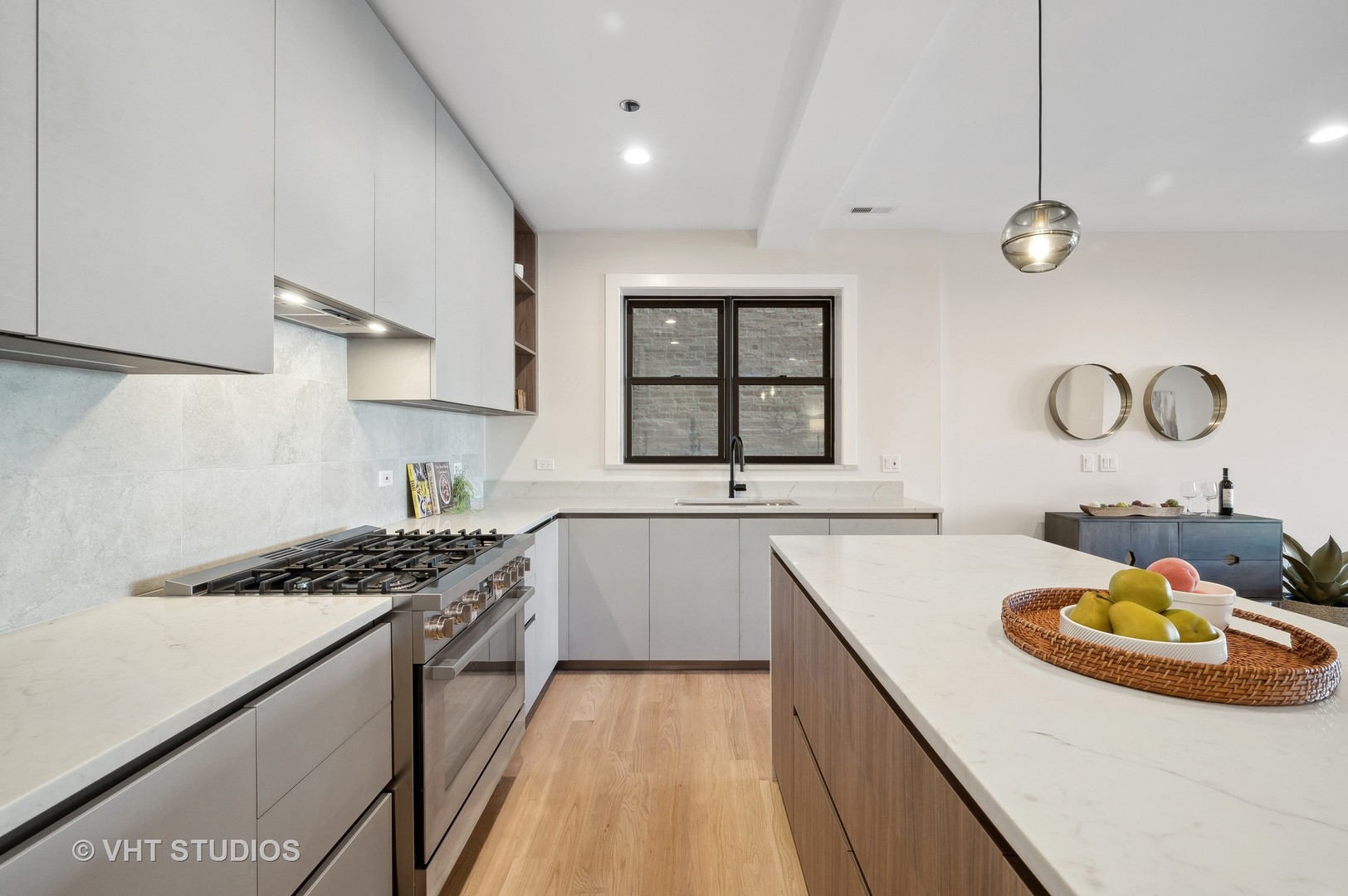 4537 North Clark Street, Unit 2D Chicago, IL 60640 - Photo 12 of 27 a kitchen with sink stove and cabinets