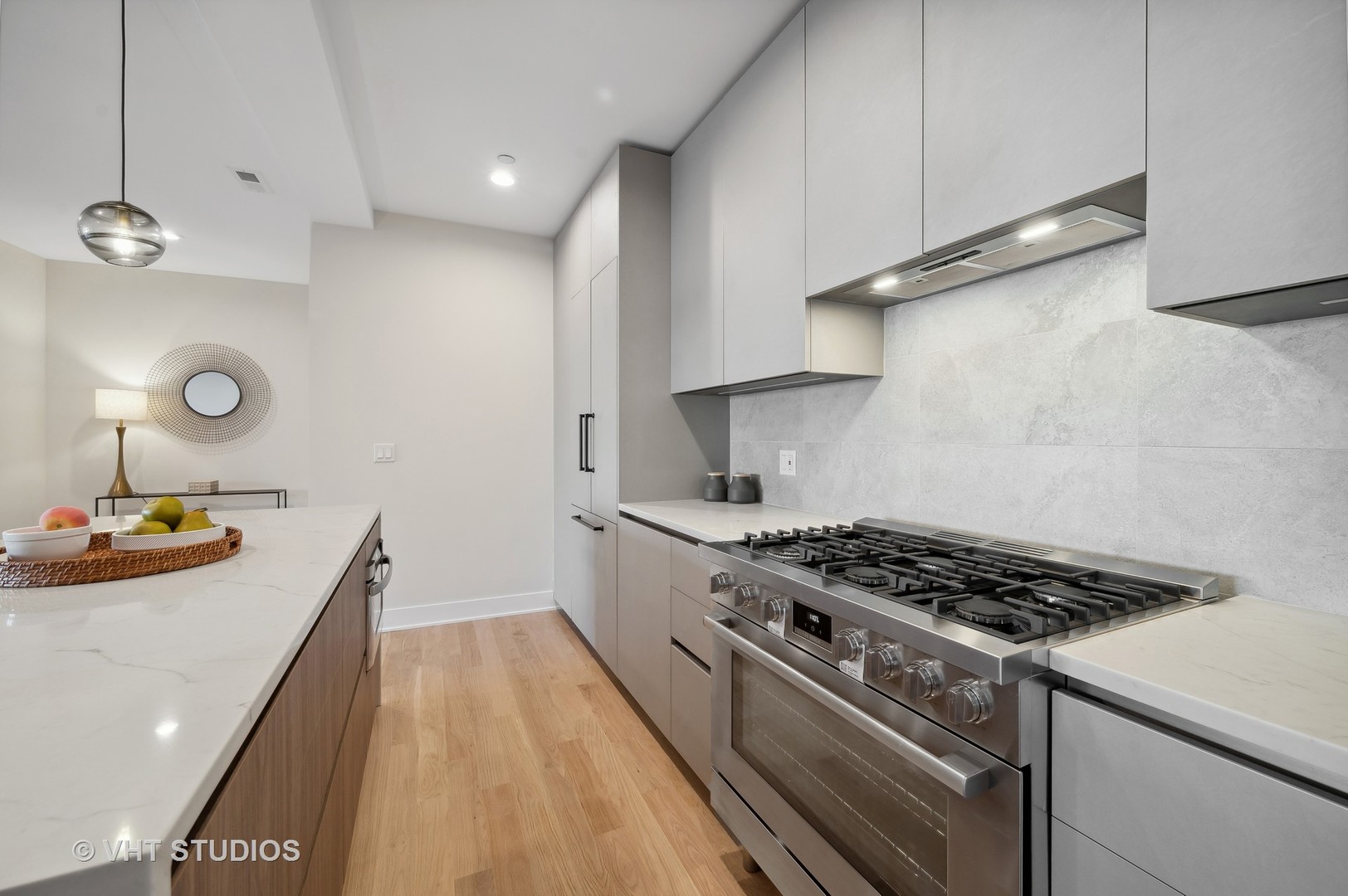 4537 North Clark Street, Unit 2D Chicago, IL 60640 - Photo 13 of 27 a kitchen with granite countertop a stove and a sink