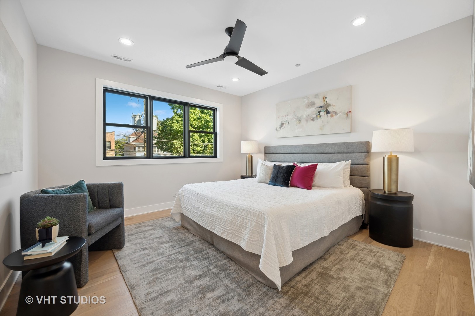 4537 North Clark Street, Unit 2D Chicago, IL 60640 - Photo 16 of 27 a bedroom with a bed and chair