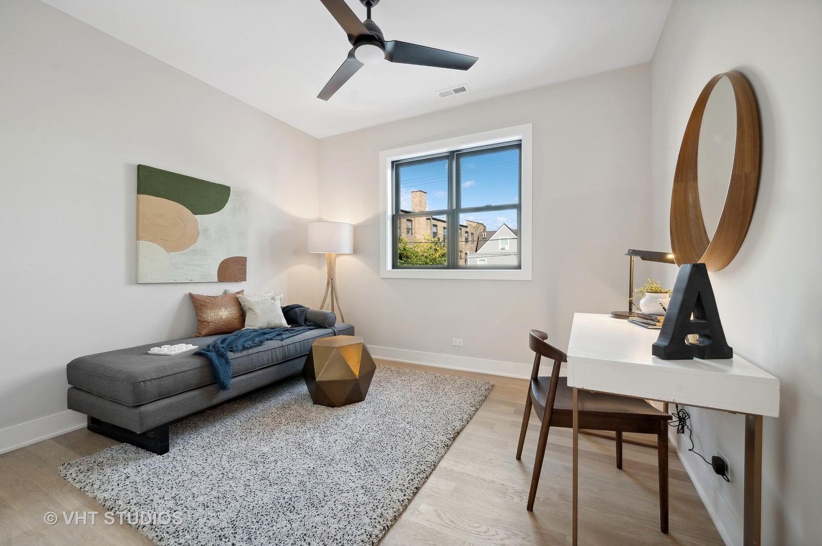 4537 North Clark Street, Unit 2D Chicago, IL 60640 - Photo 23 of 27 a living room with furniture a mirror and a window