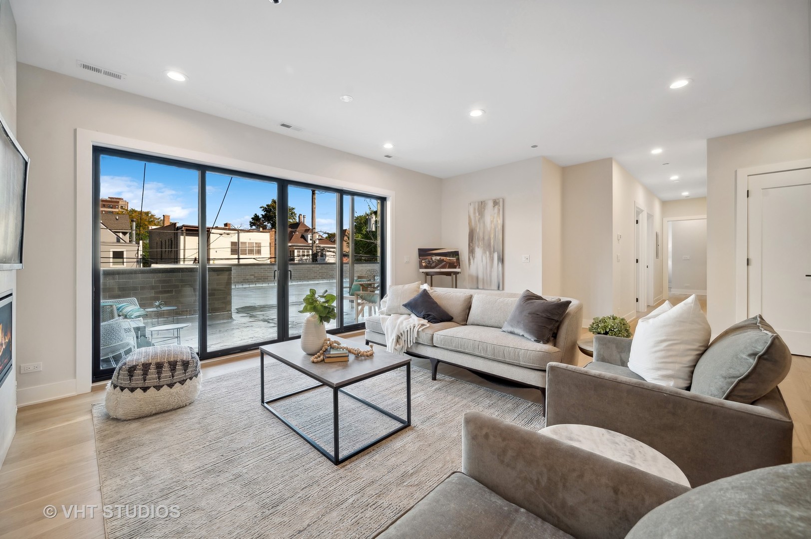 4537 North Clark Street, Unit 2D Chicago, IL 60640 - Photo 5 of 27 a living room with furniture and a glass door