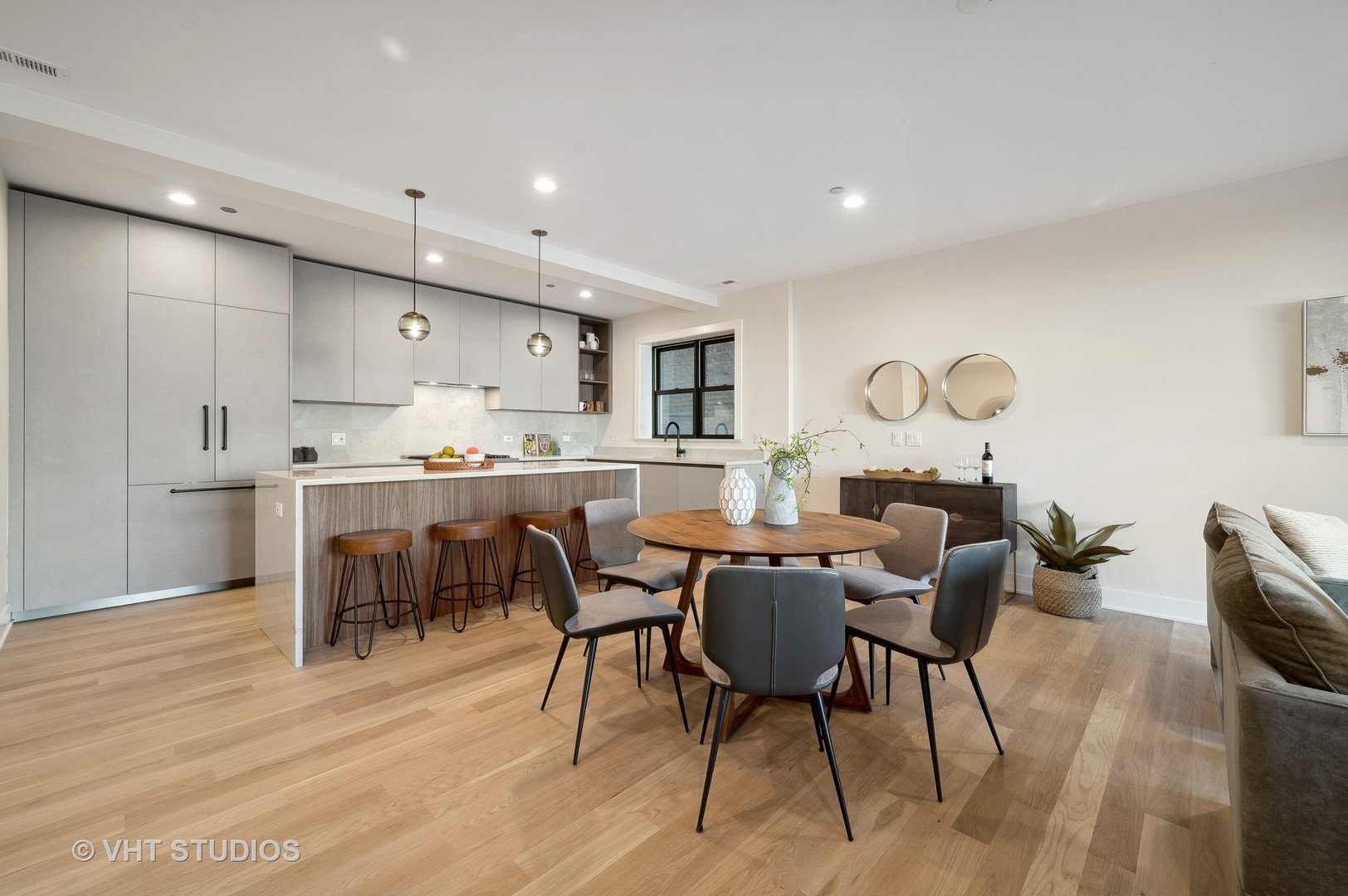 4537 North Clark Street, Unit 2D Chicago, IL 60640 - Photo 8 of 27 a living room with kitchen island furniture and a dining table