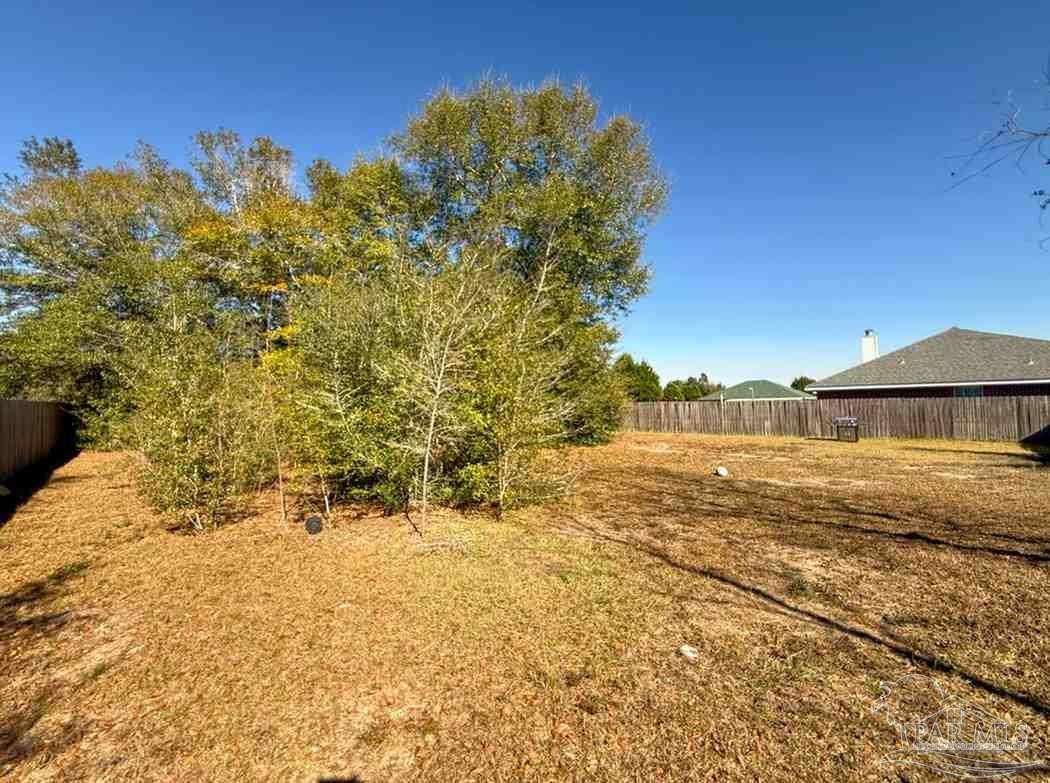 8826 Bluebell Street Milton, FL 32583 - Photo 11 of 25 a view of a yard with an ocean view