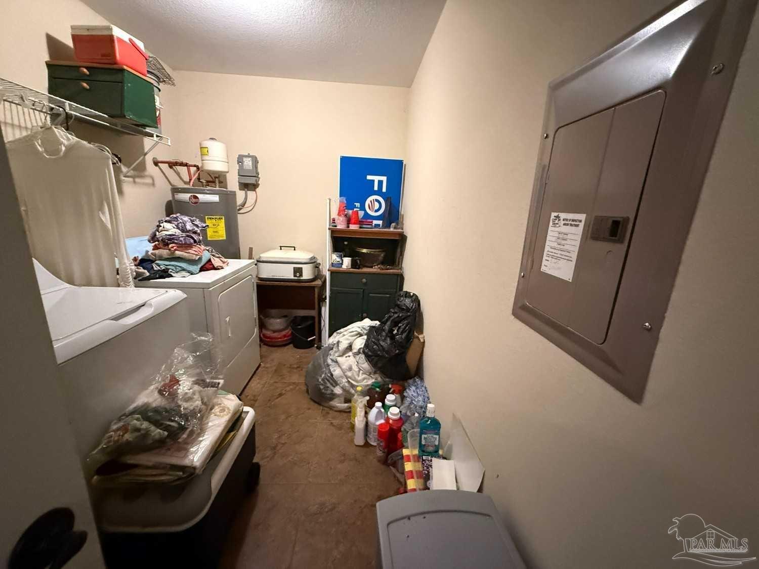 8826 Bluebell Street Milton, FL 32583 - Photo 22 of 25 a living room with furniture and a flat screen tv
