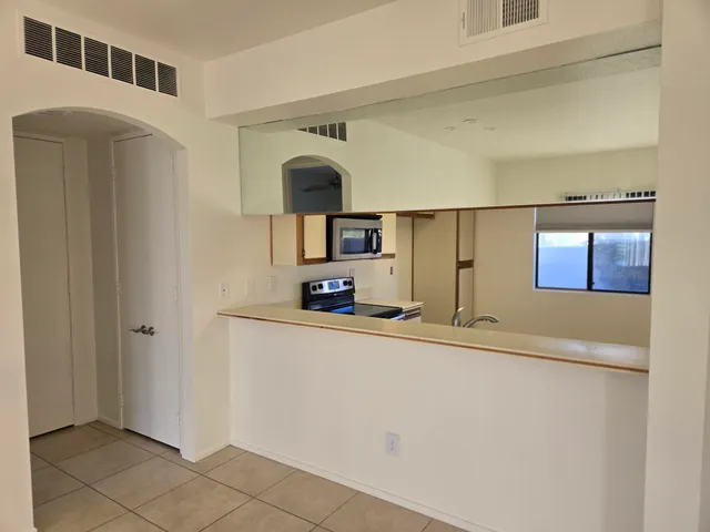 a kitchen with stainless steel appliances a refrigerator and a sink