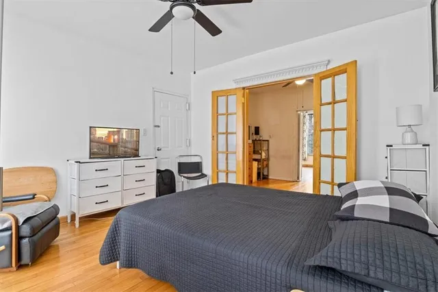 a kitchen with stainless steel appliances granite countertop a refrigerator a stove top oven and a sink