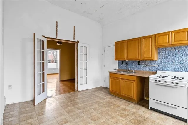 a view of an empty room and wooden floor