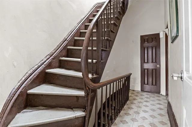 a view of kitchen with wooden floor and electronic appliances