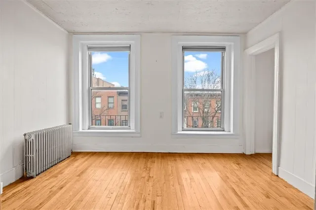 a view of a large building with a bench