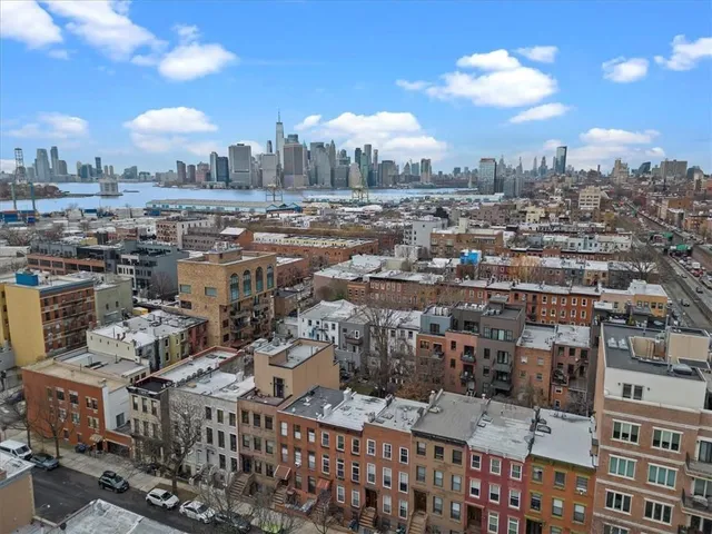 a view of a city with tall buildings