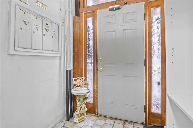 a kitchen with granite countertop a stove a sink dishwasher and a refrigerator