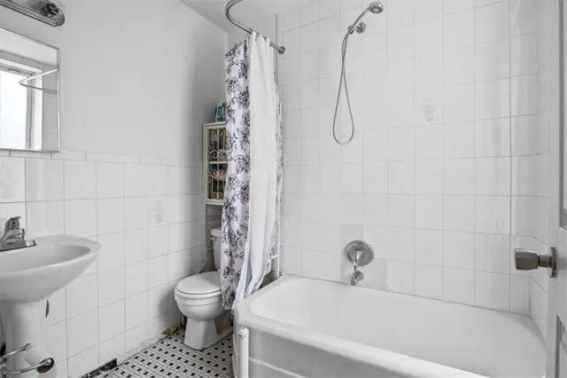 a bedroom with a bed and furniture