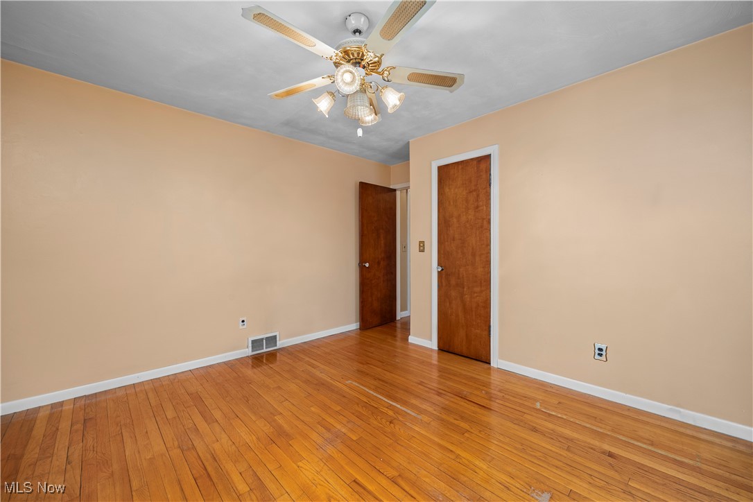 25950 Bagley Road Olmsted Falls, OH 44138 - Photo 17 of 32 Spare room featuring light wood finished floors and ceiling fan