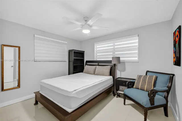 a bedroom with a bed and a chair